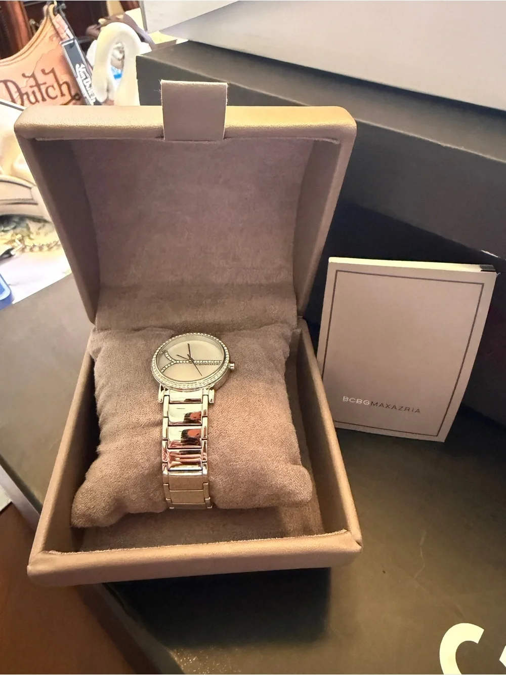 BCBGMAXAZRIA silver watch with diamond accents. Needs battery.